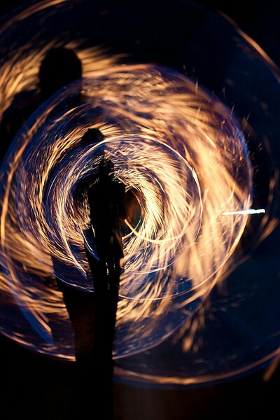 "Silhouette Of A Person Holding A Sparkler"